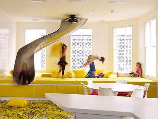 kids playing in a room with a slide