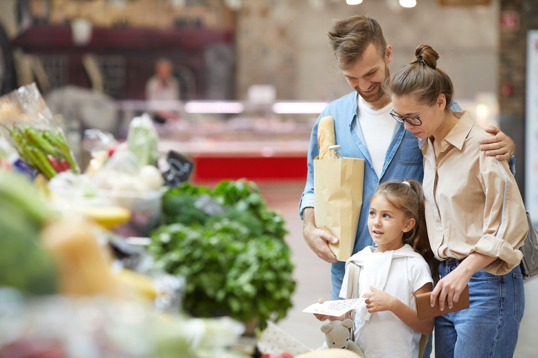 Family identifying items at a local market to practice city vocabulary