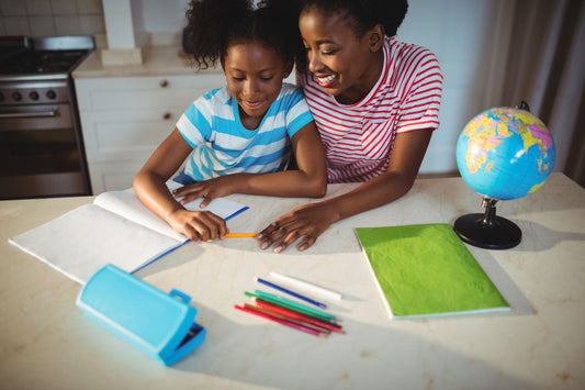 Mom and Child at Kitchen Table with Schoolwork