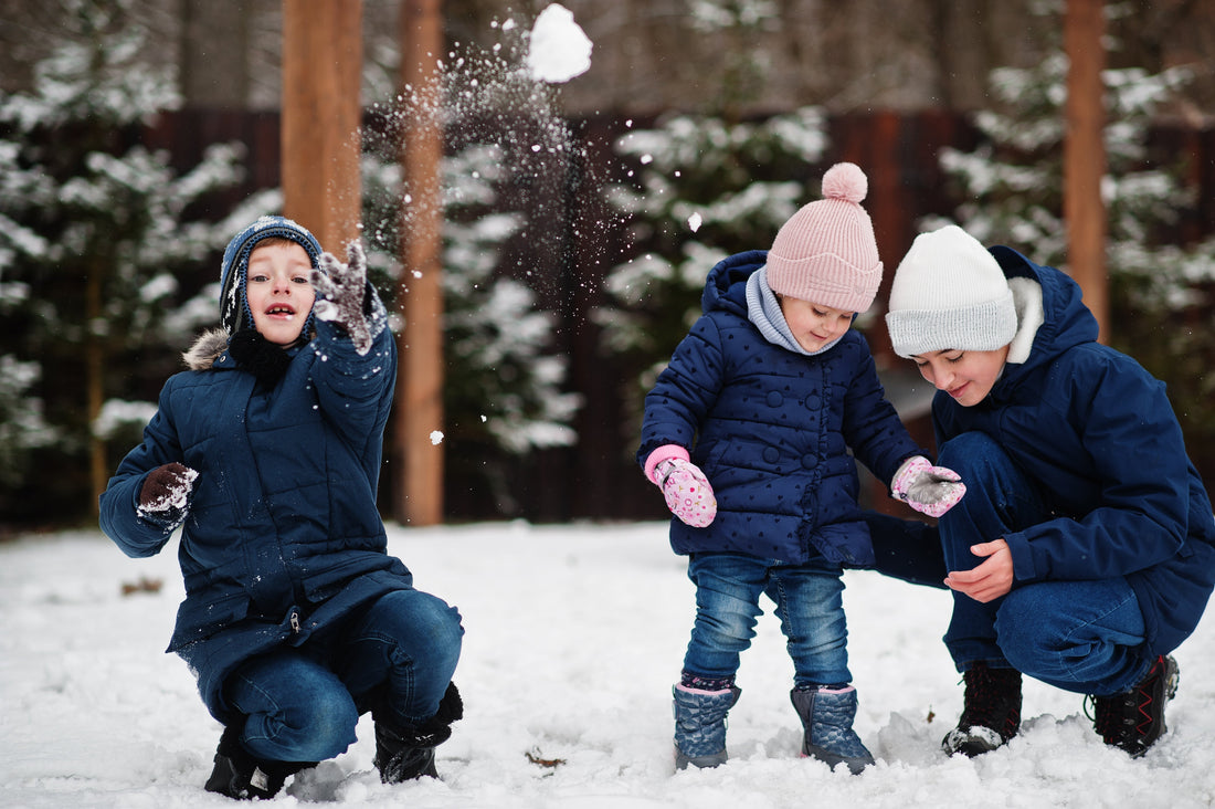 Family Playing in Snow Practicing Language