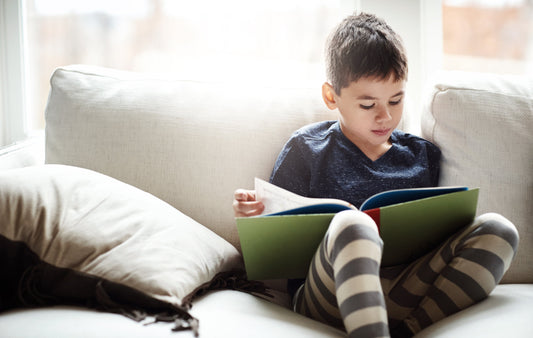 child reading on the couch